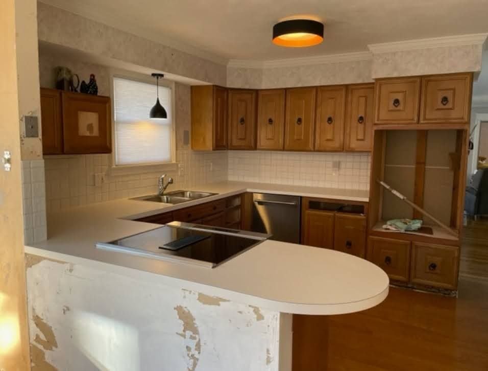 Wood cabinets and peninsula before