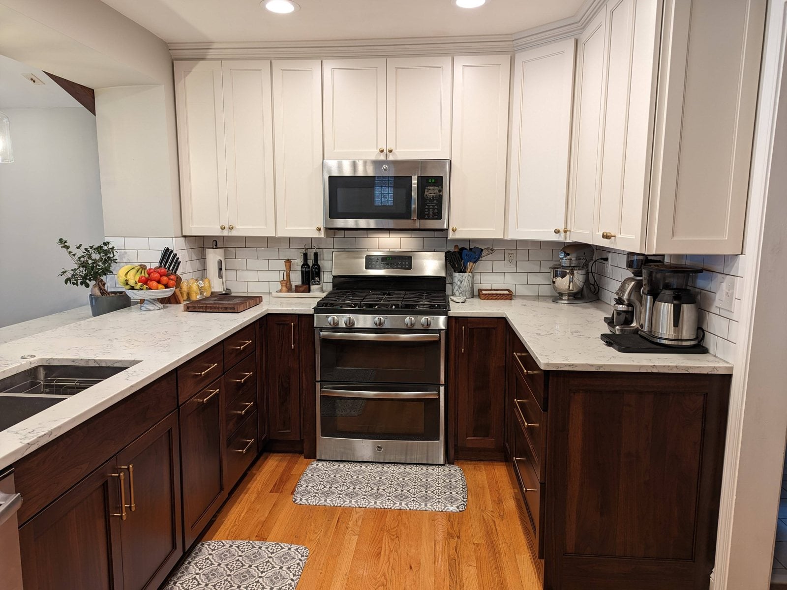 Antique white uppers over walnut lower cabinets