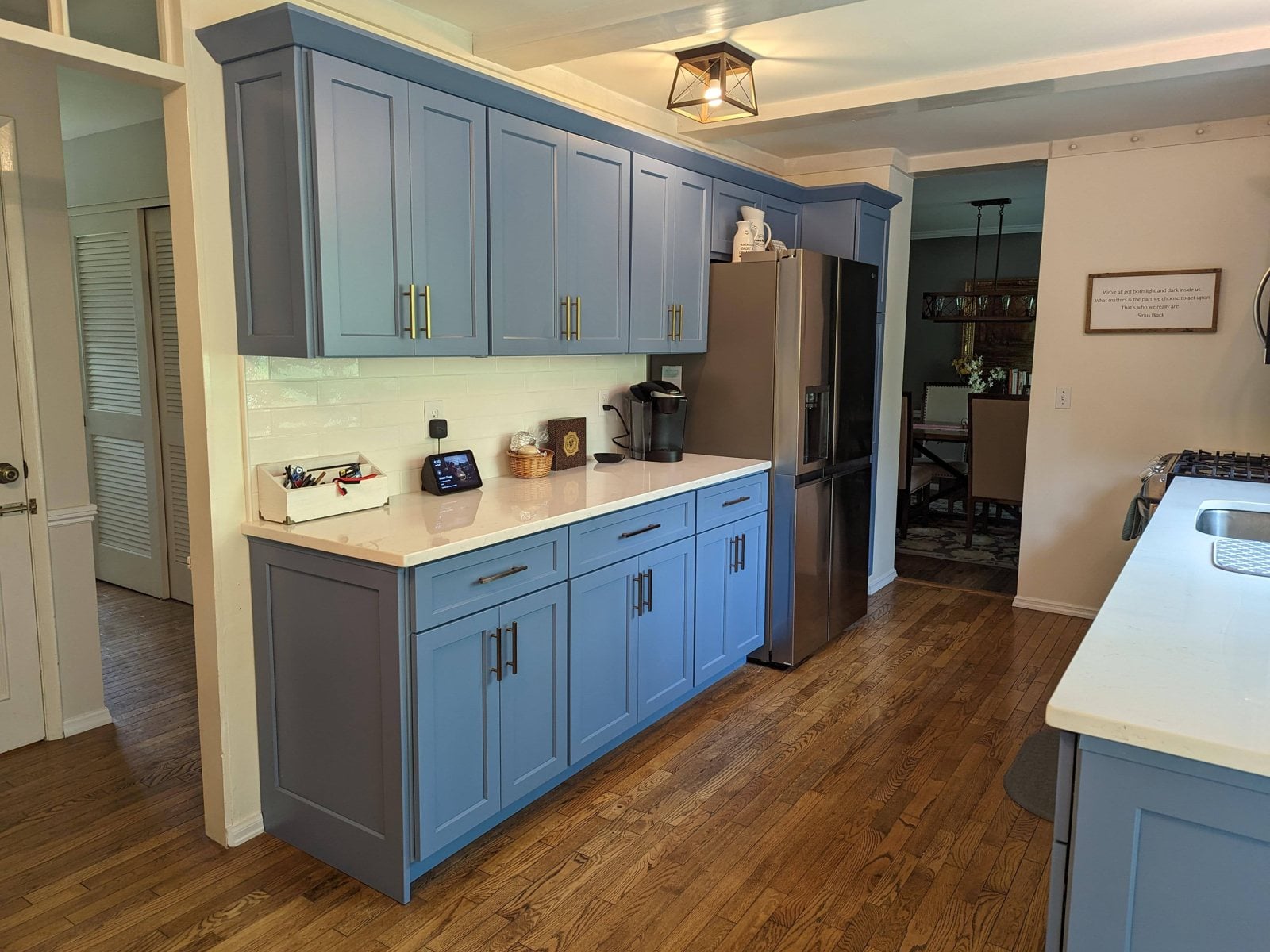Blue painted cabinets with white counters